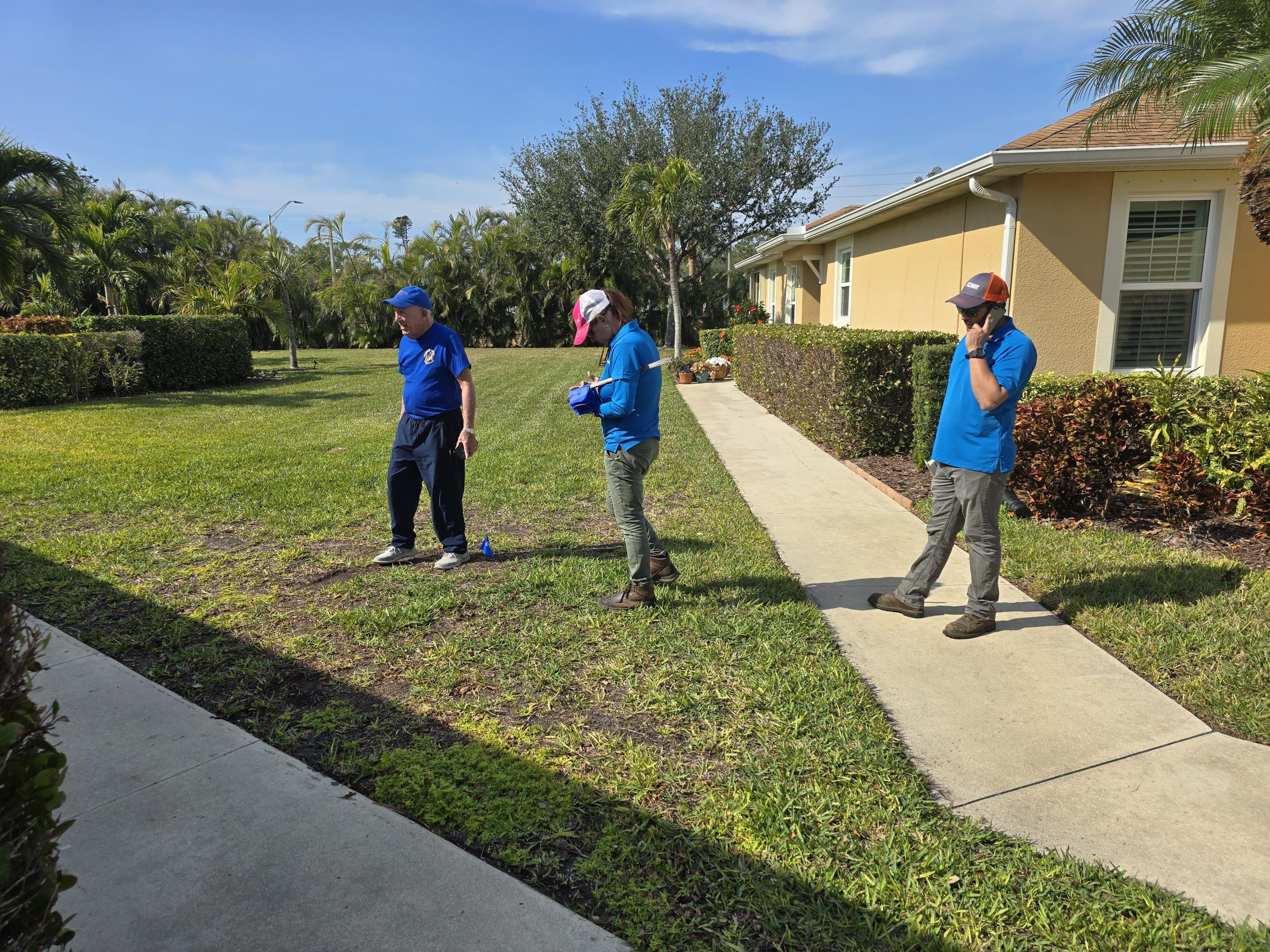yard inspection viv larry checking for chinch Bugs
